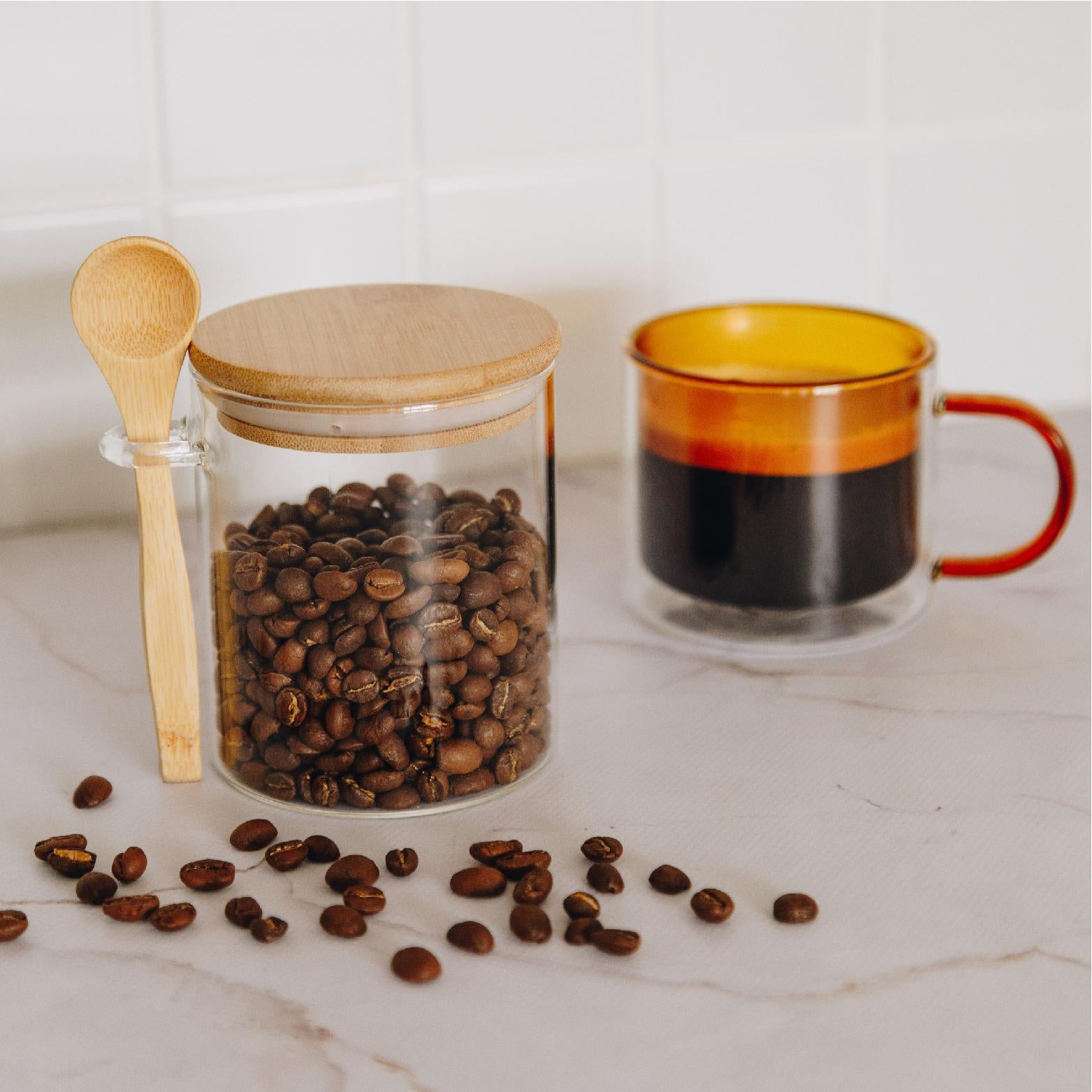 https://www.thehomequarter.co.za/cdn/shop/products/glass-jar-with-bamboo-lid-and-spoon-styled-1.jpg?v=1689862408