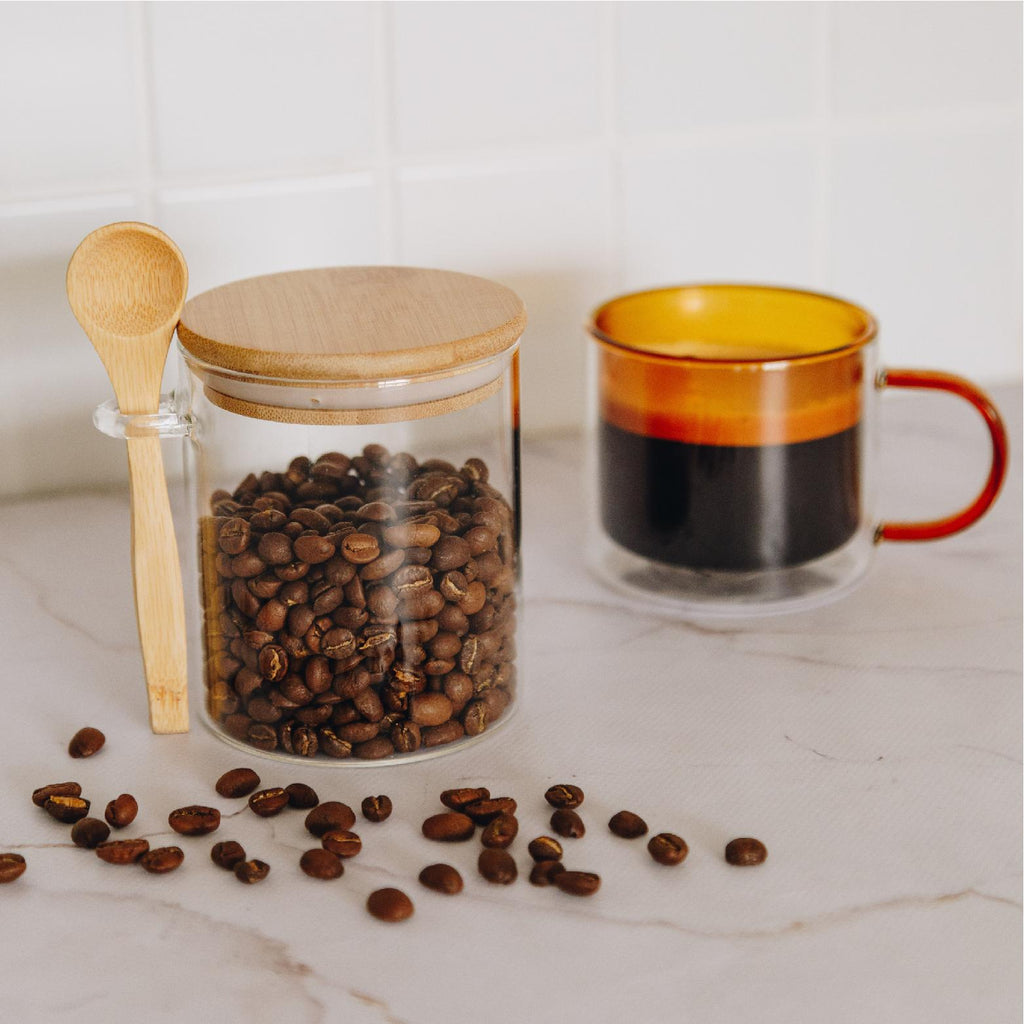 Glass storage jar with a bamboo lid and spoon