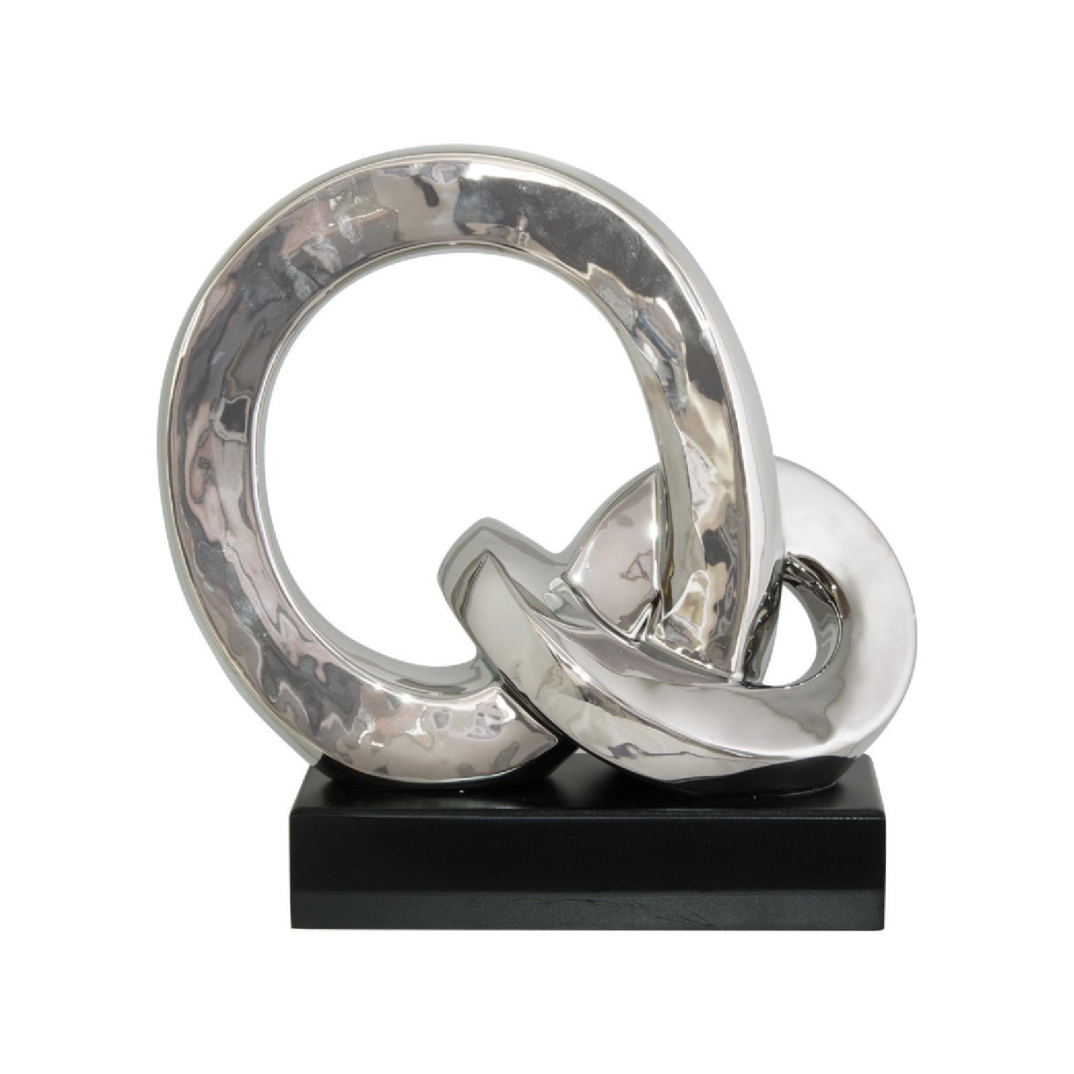 Silver decorative rings on a black base