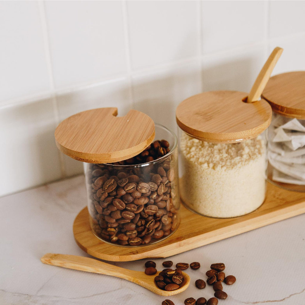 Glass storage set with bamboo display tray and lids and spoons